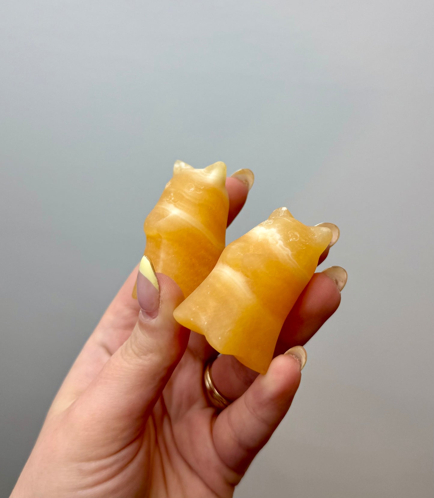 Orange calcite ghost cat carvings
