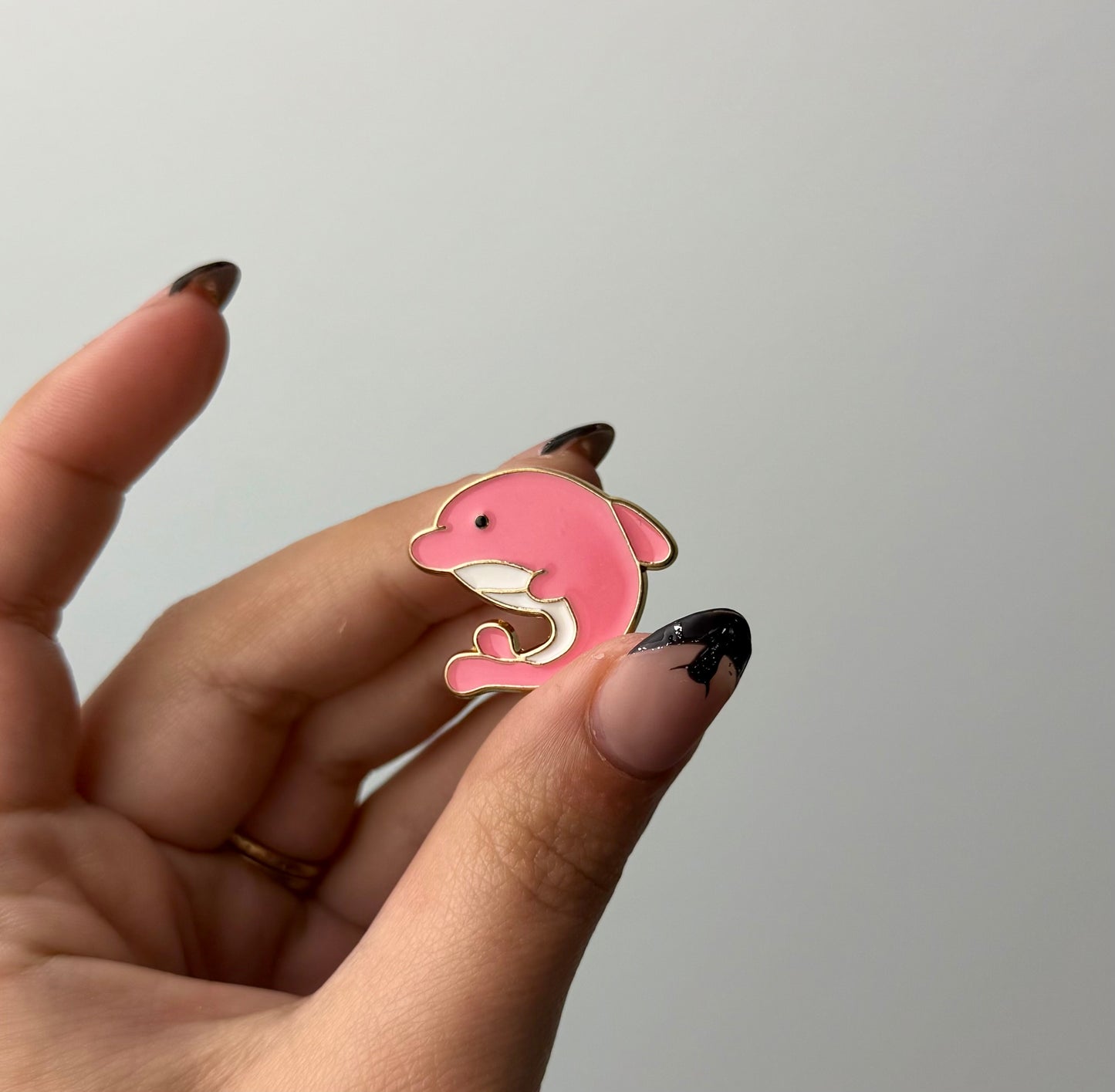 Pink dolphin enamel pin