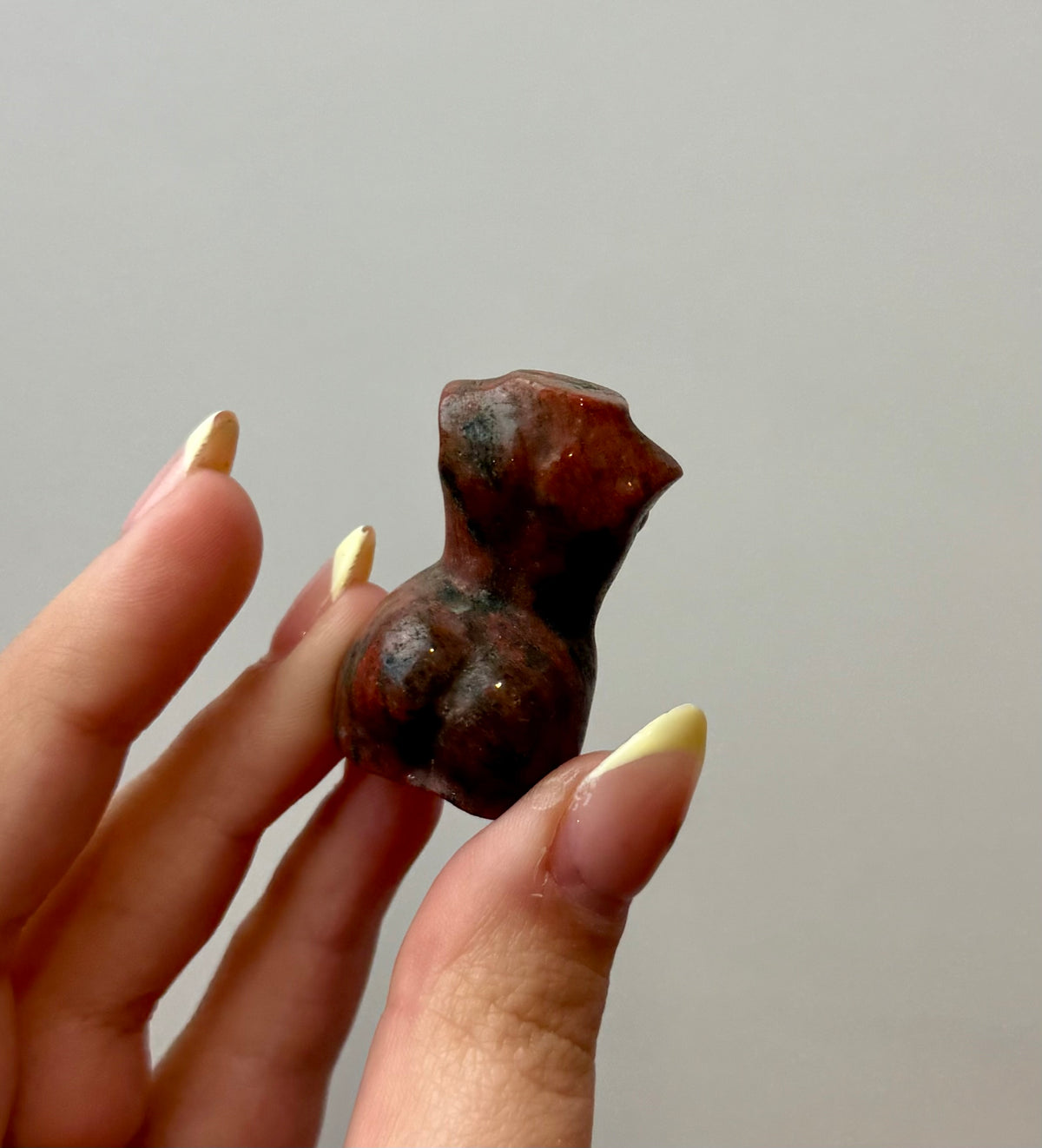Brecciated jasper woman body carving