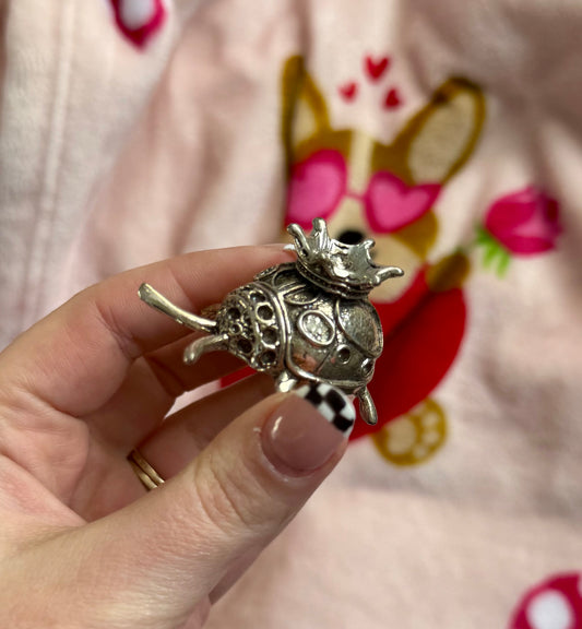 Silver ladybug sphere stand