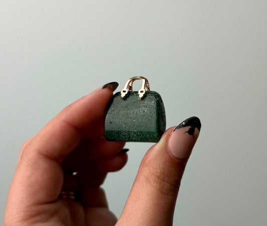 Moss agate purse carving