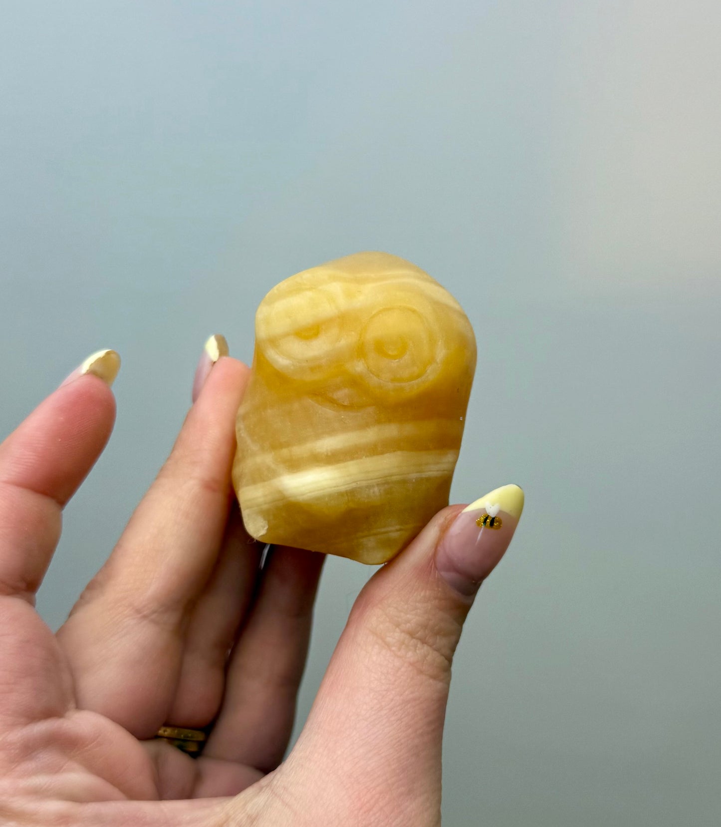 Orange calcite minion carving