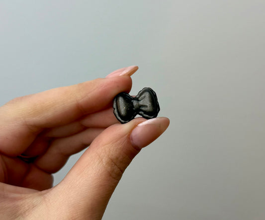 Silver obsidian bow carvings