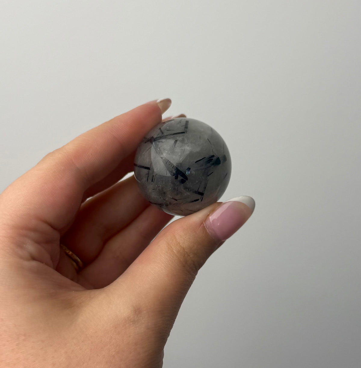 Black tourmaline in quartz sphere