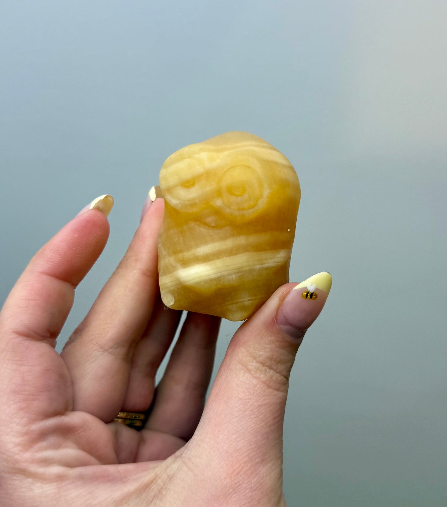 Orange calcite minion carving