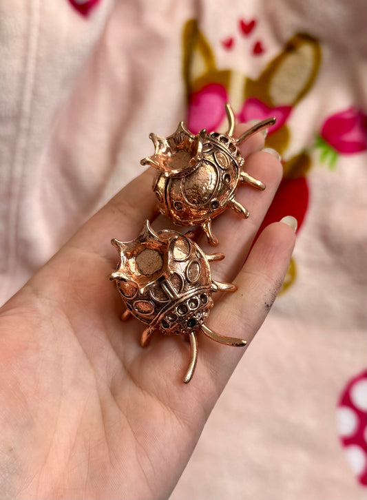 Rose gold dark ladybug sphere stands