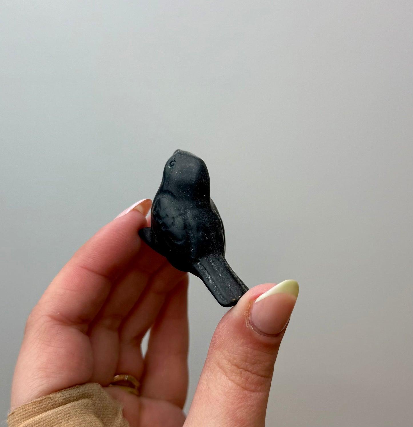 Obsidian bird carving