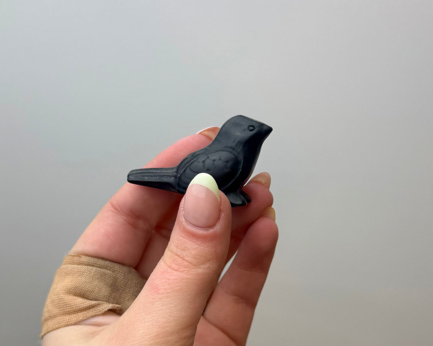 Obsidian bird carving