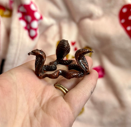 Bronze snake sphere stand