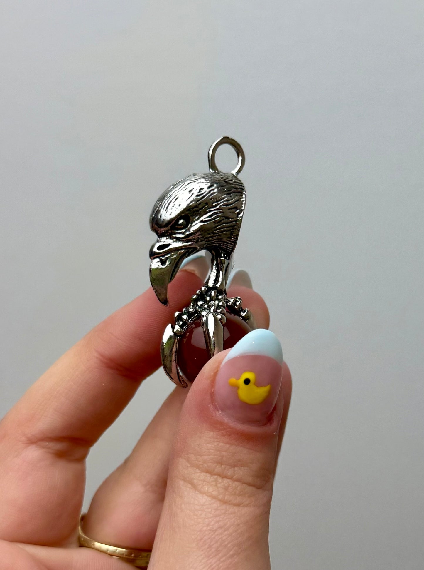 Carnelian eagle claw fidget pendant