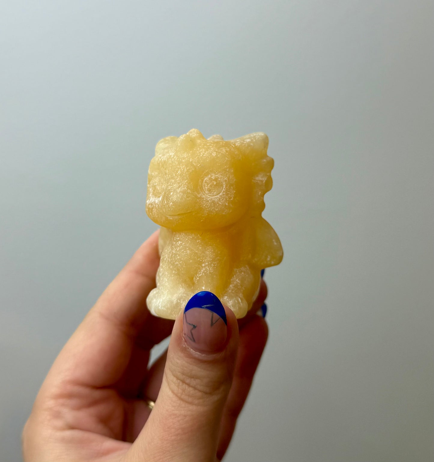 Orange calcite dragon carving