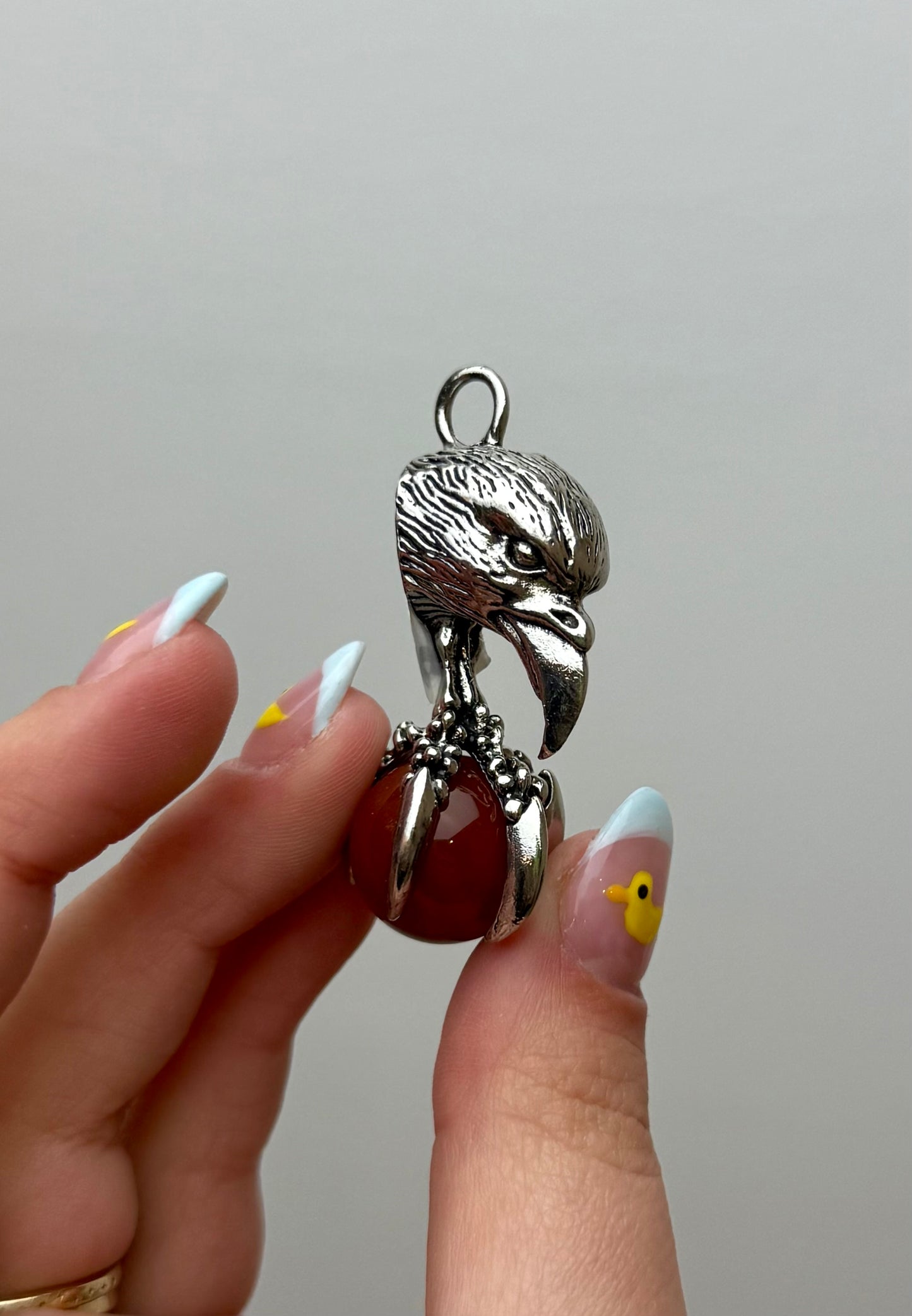 Carnelian eagle claw fidget pendant
