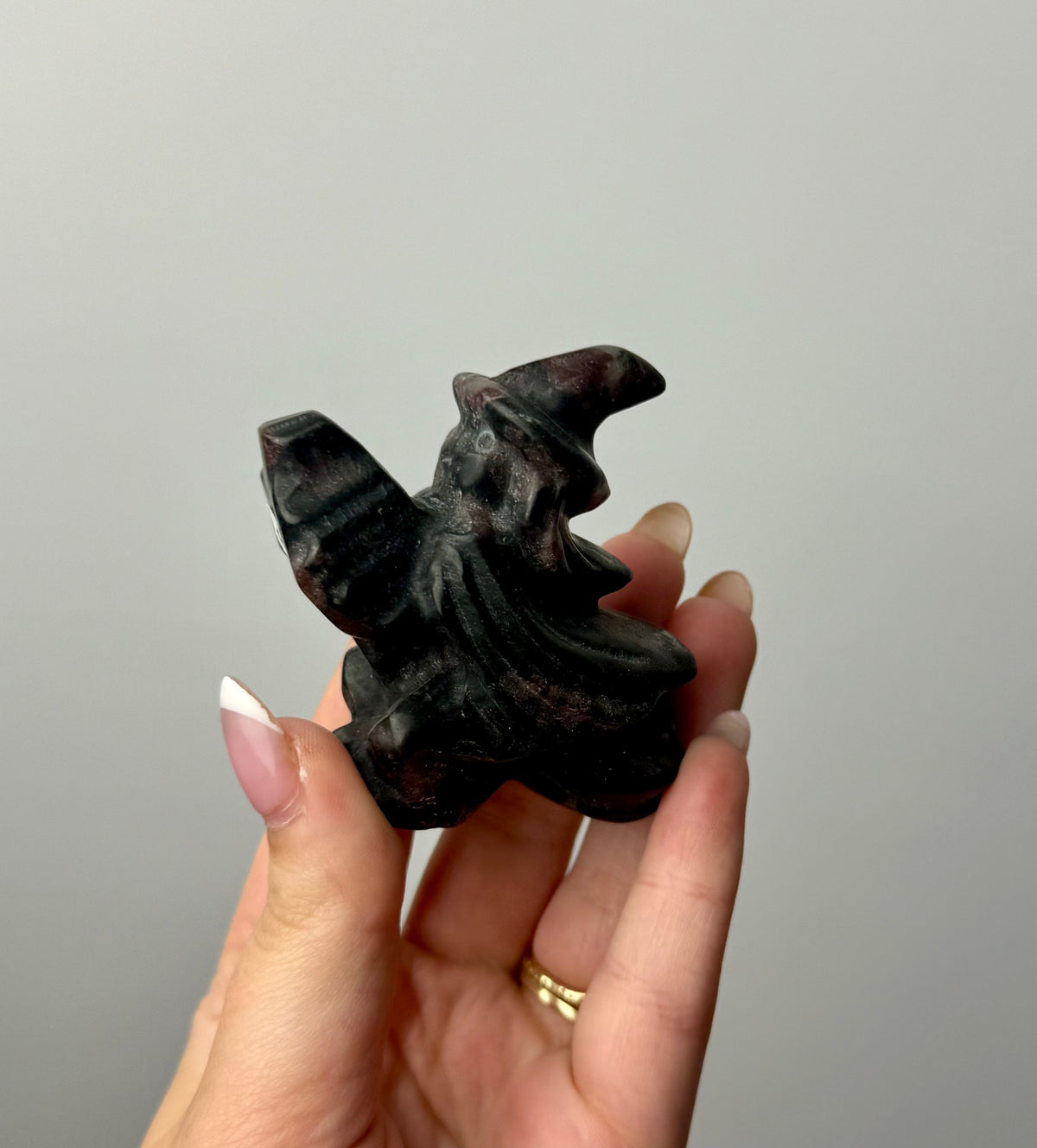 Flying witch carving