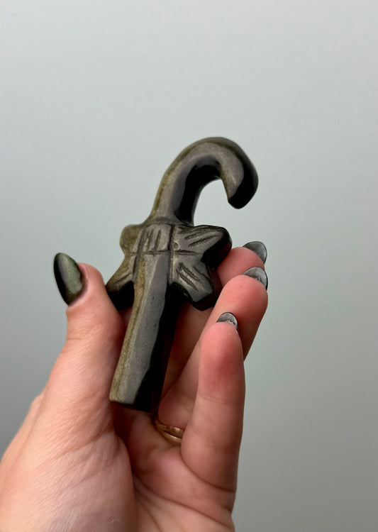 Gold sheen obsidian candy cane carving