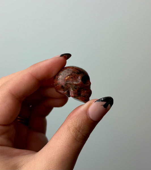 Brecciated jasper skull carving