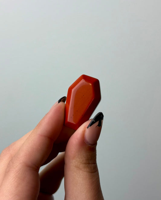 Red jasper coffin carving
