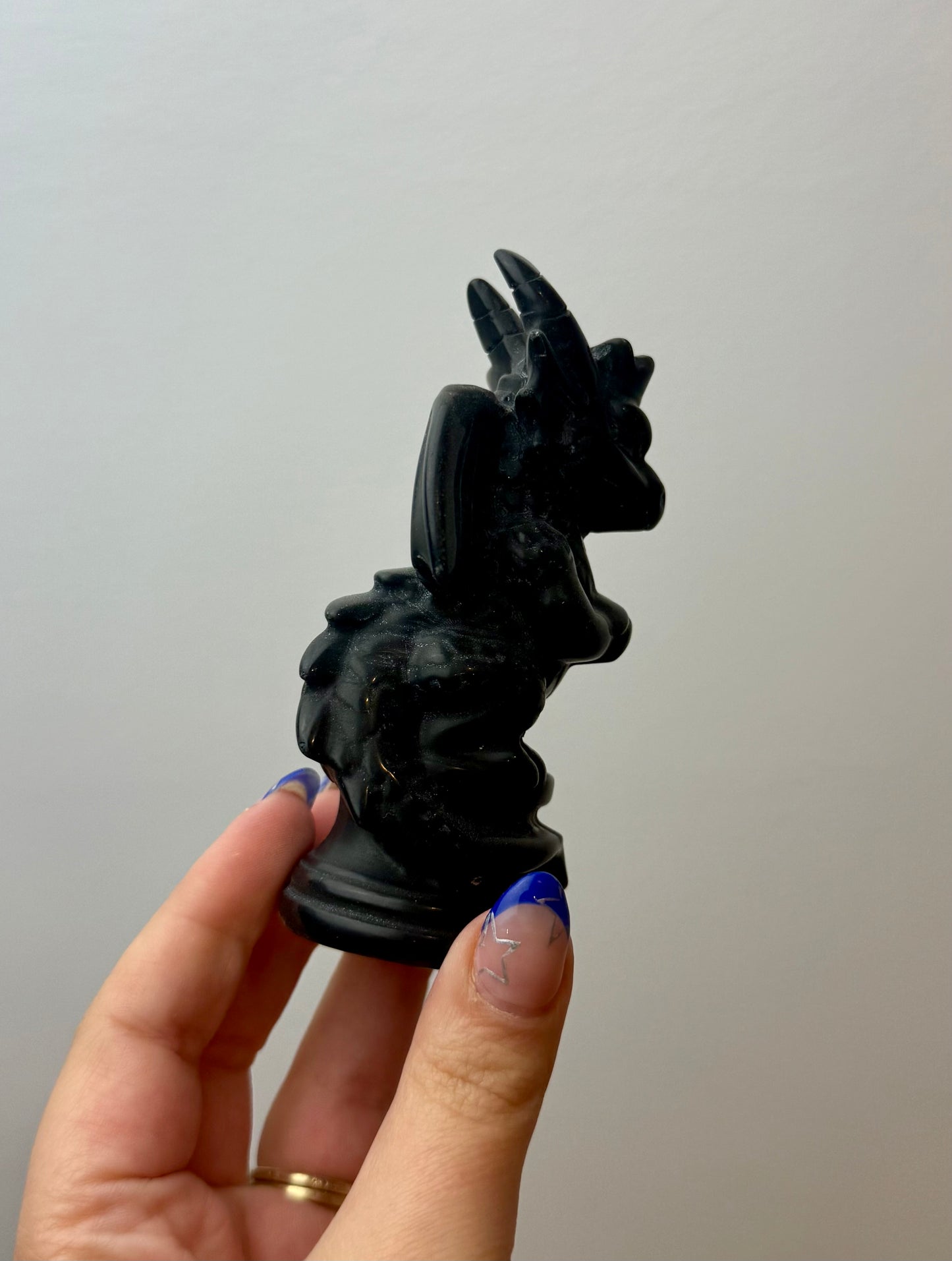 Obsidian dragon carving