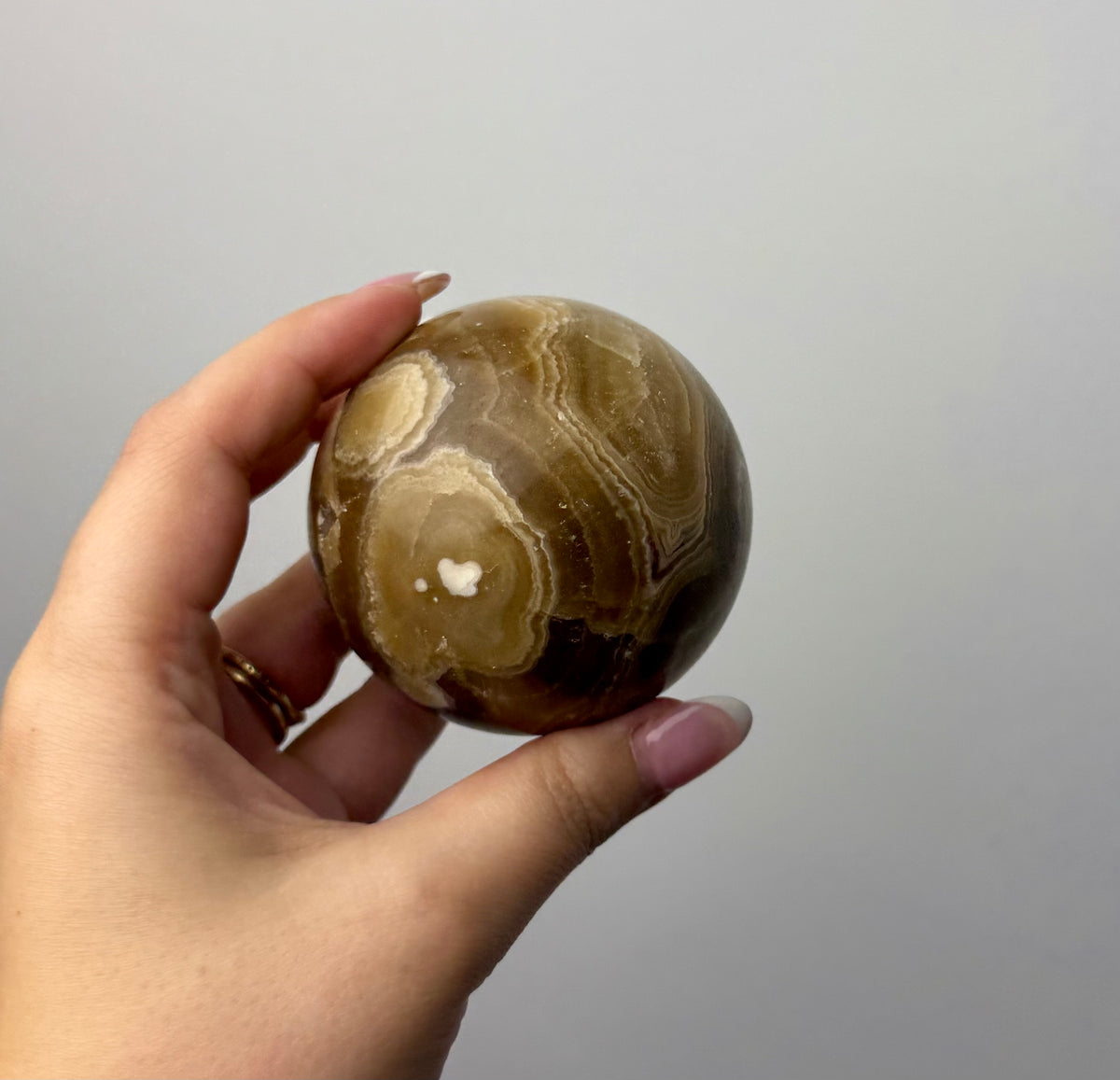 Amber calcite sphere