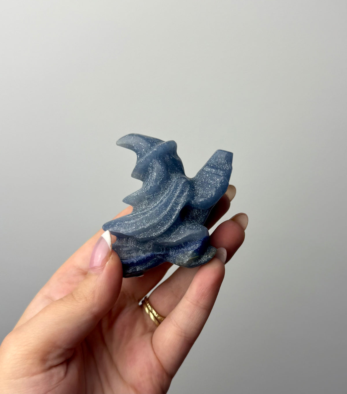 Flying witch carving