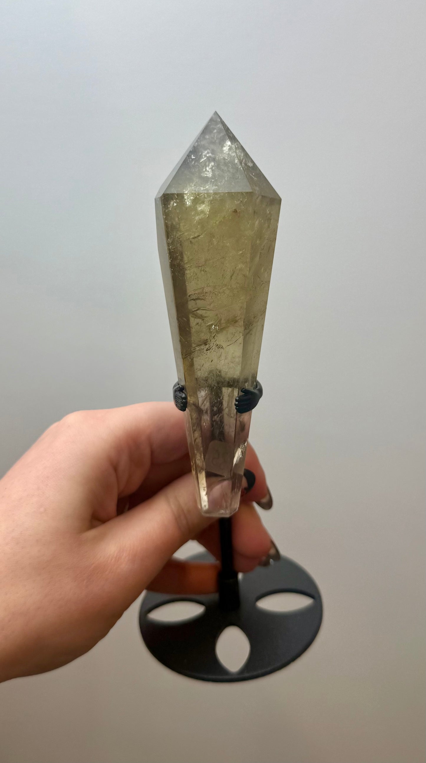 Smoky quartz wand on a stand