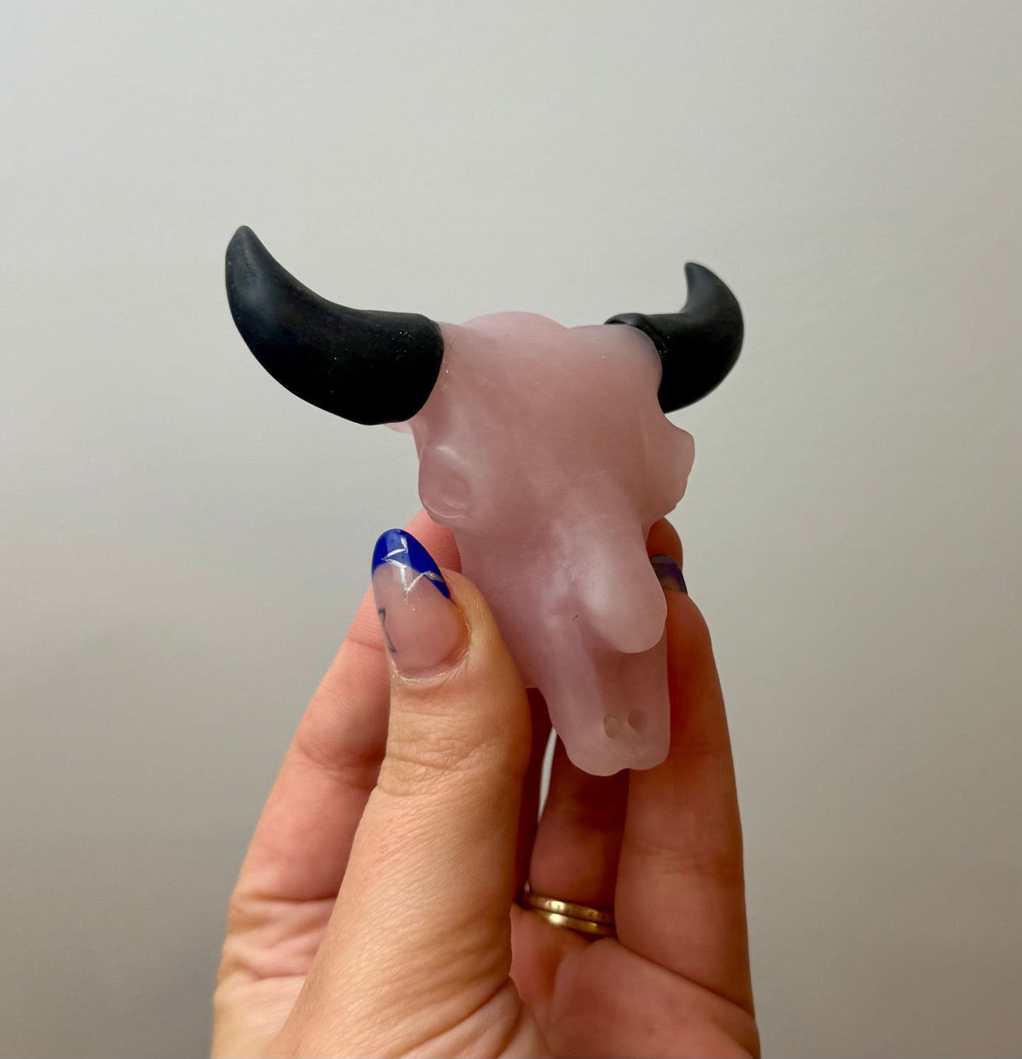 Rose quartz cow skull carving