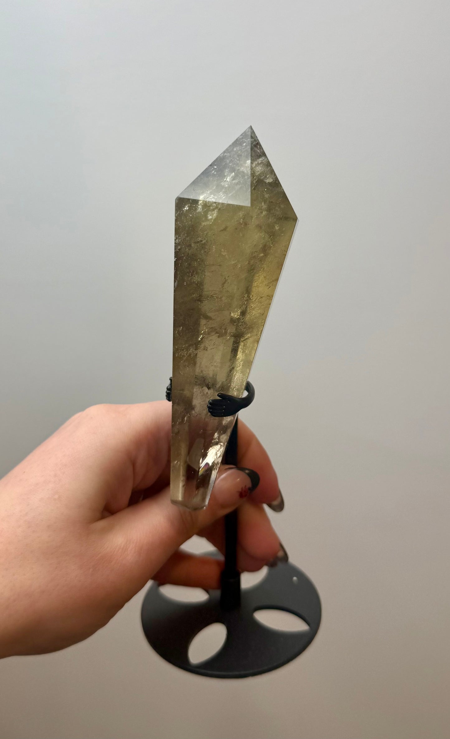 Smoky quartz wand on a stand