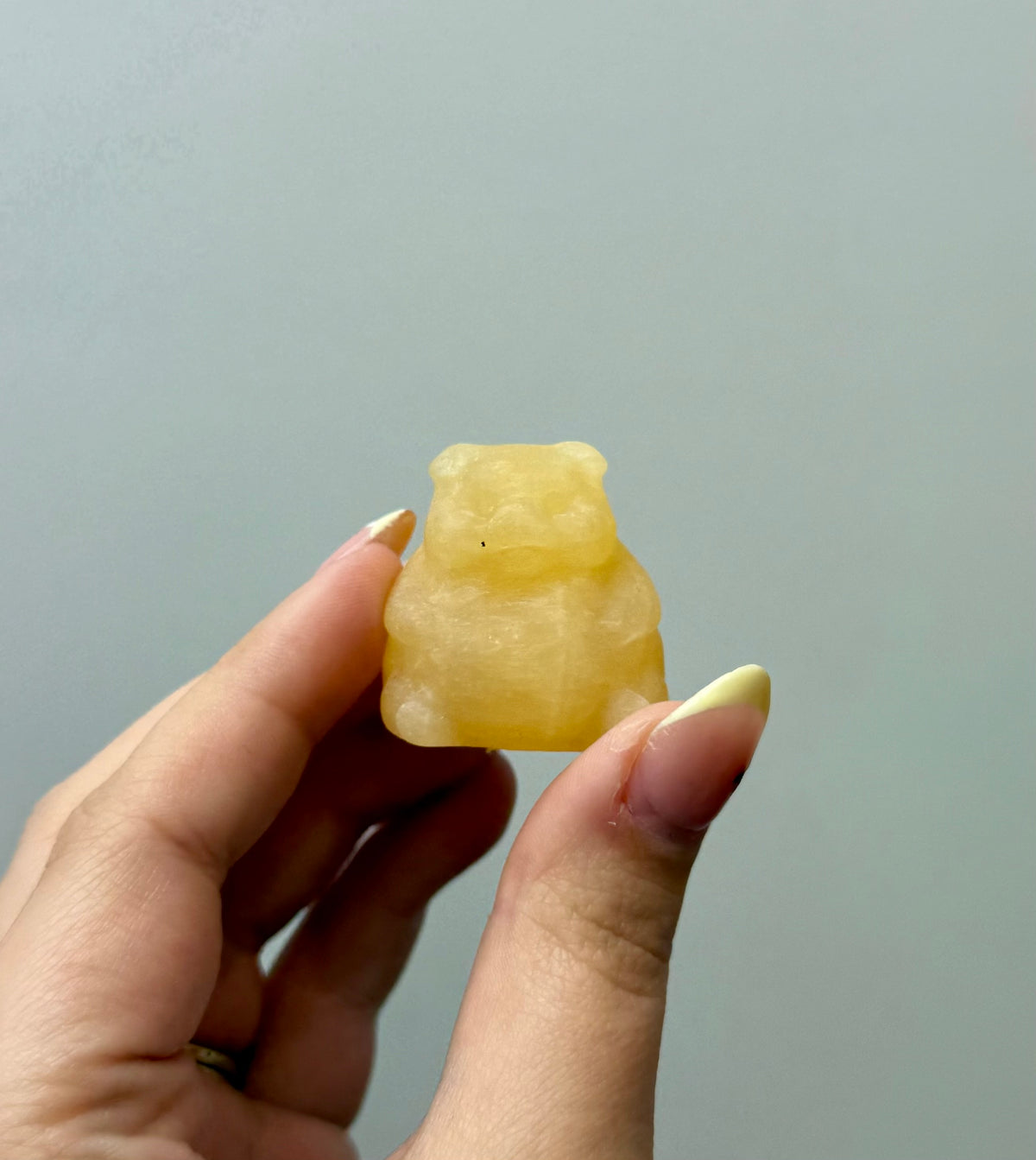 Orange calcite chubby pig carving