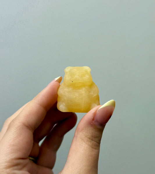 Orange calcite chubby pig carving