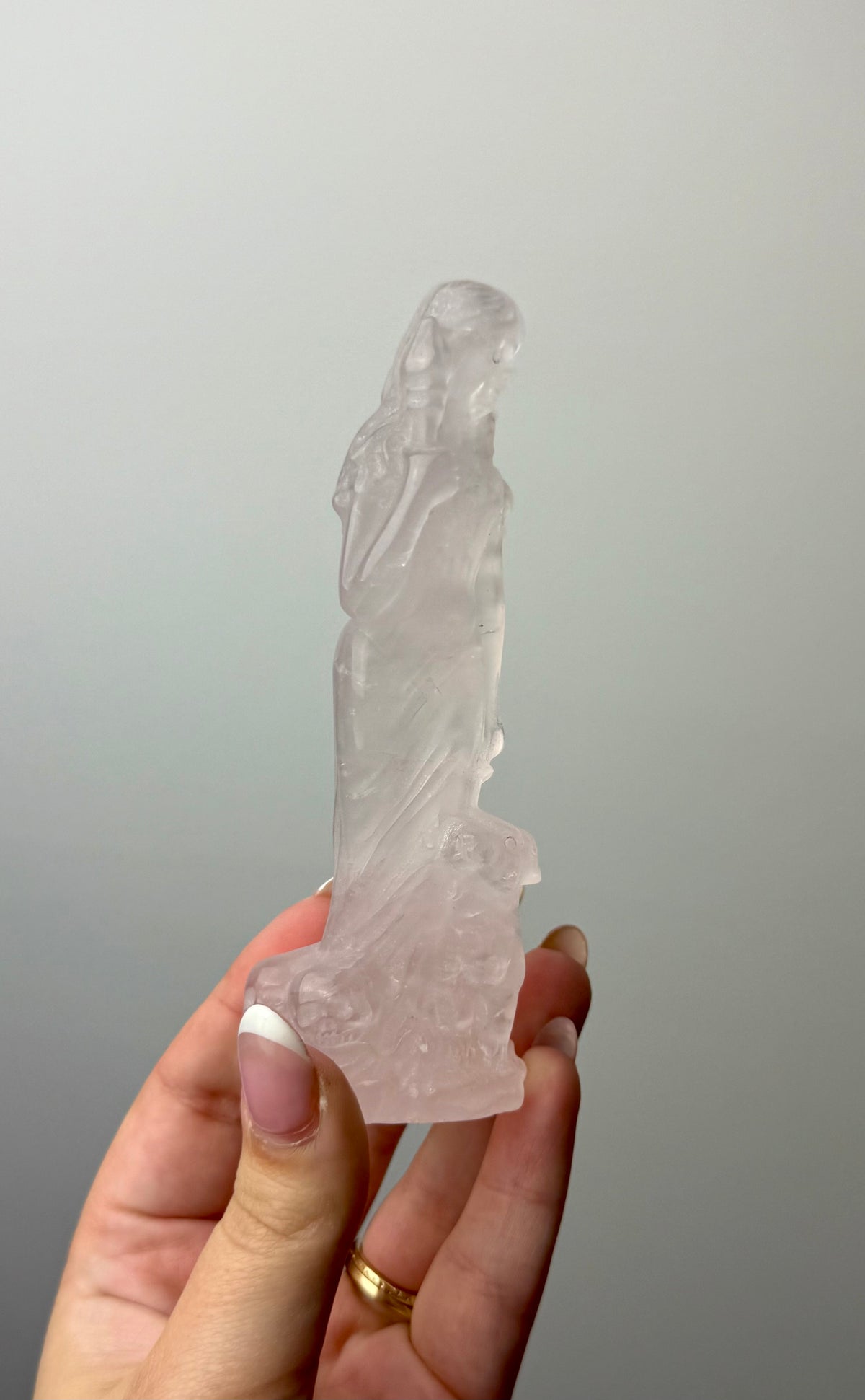 Rose quartz goddess with dog carving