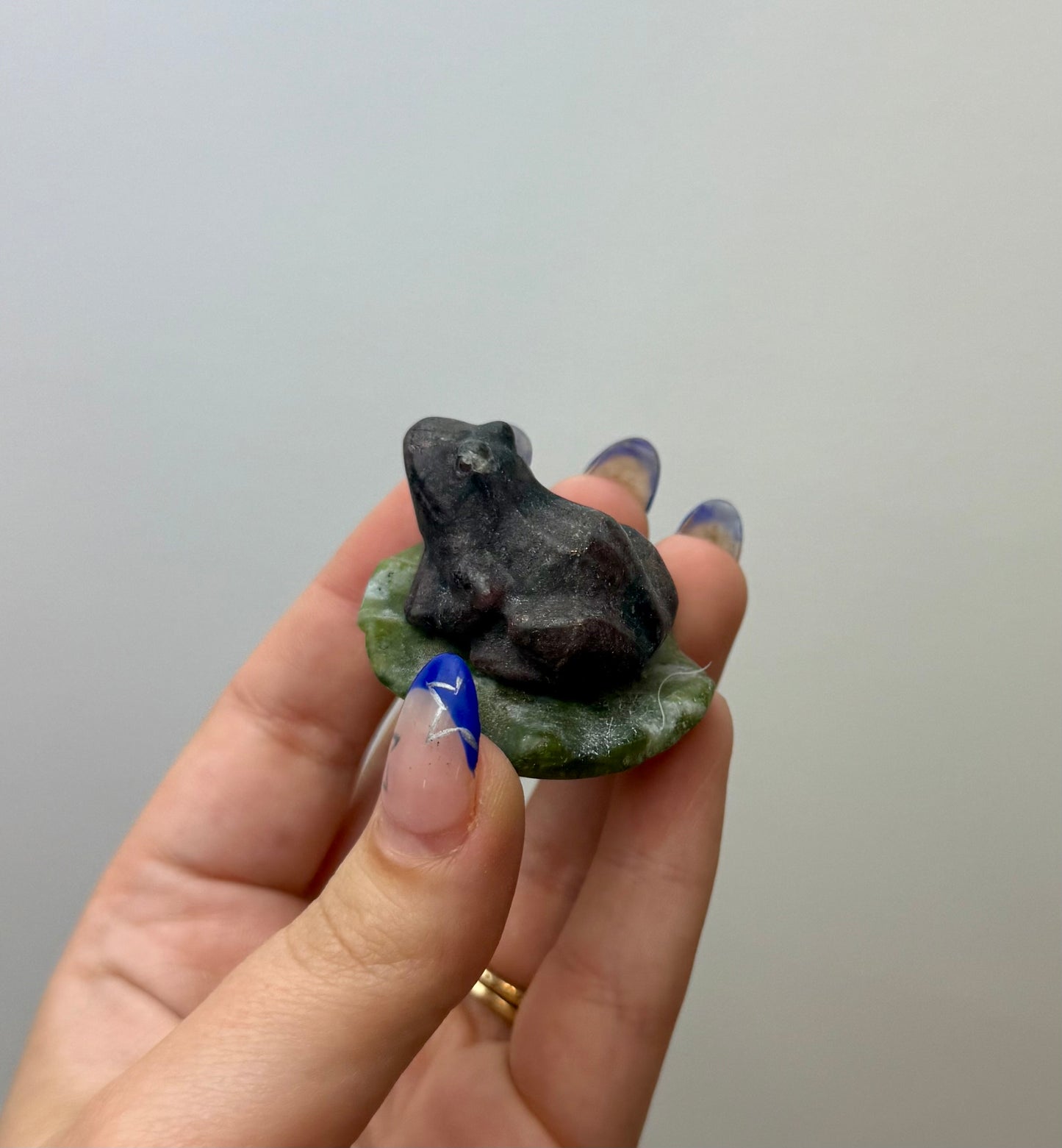 Garnet frog on a lily pad carving