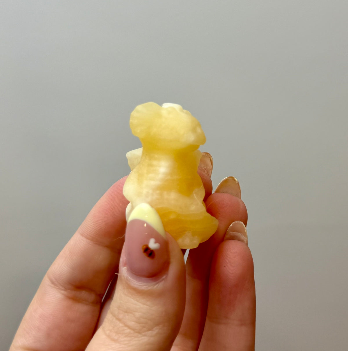 Orange calcite dragon carving