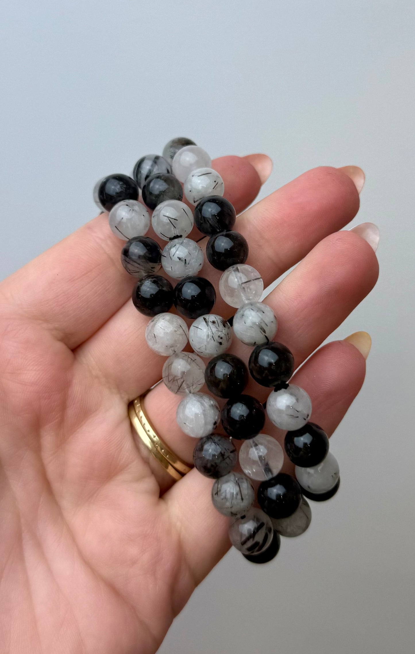 Black tourmaline in quartz bracelets