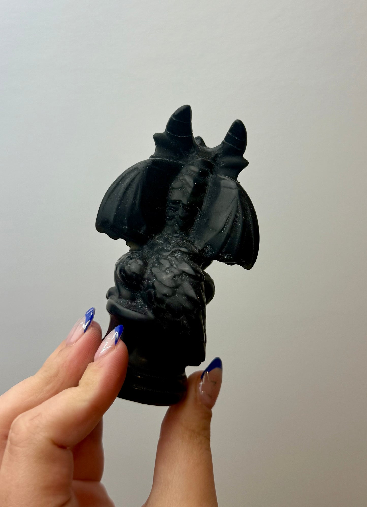 Obsidian dragon carving