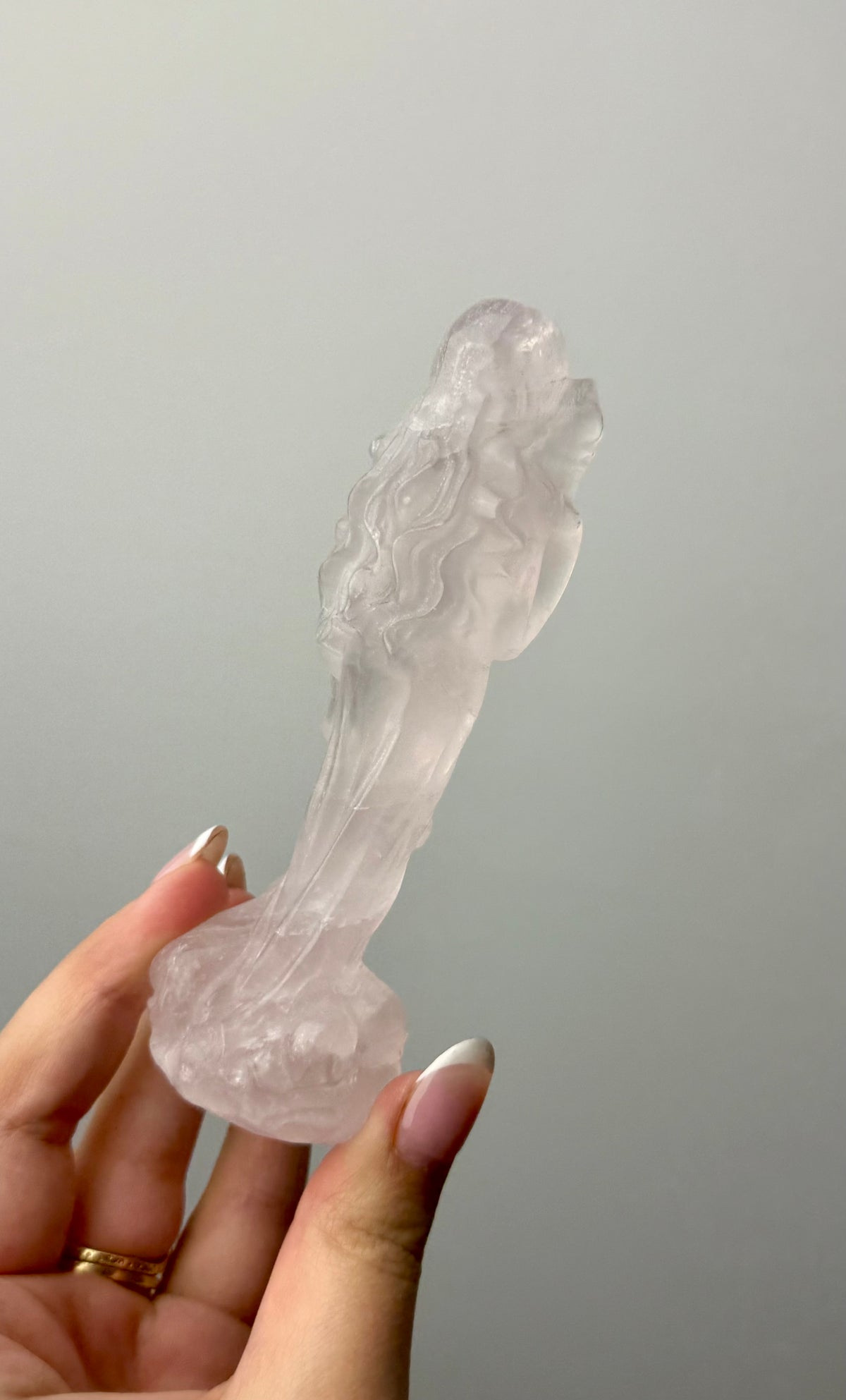 Rose quartz goddess with dog carving