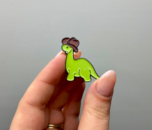 Cowboy dinosaur enamel pin