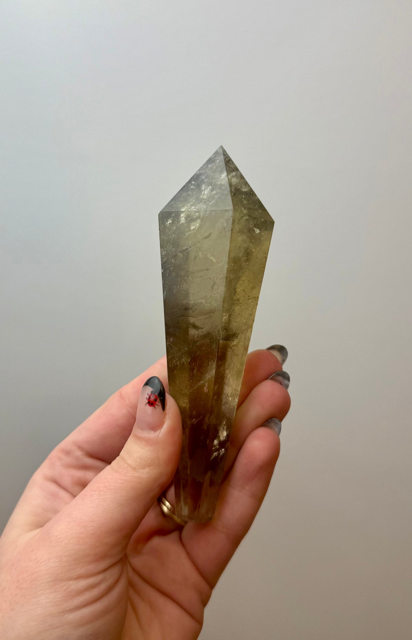 Smoky quartz wand on a stand