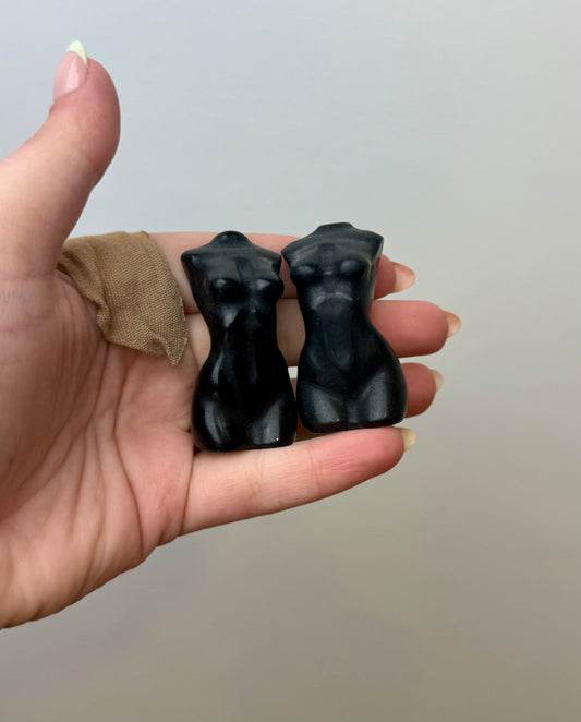 Obsidian woman body carvings