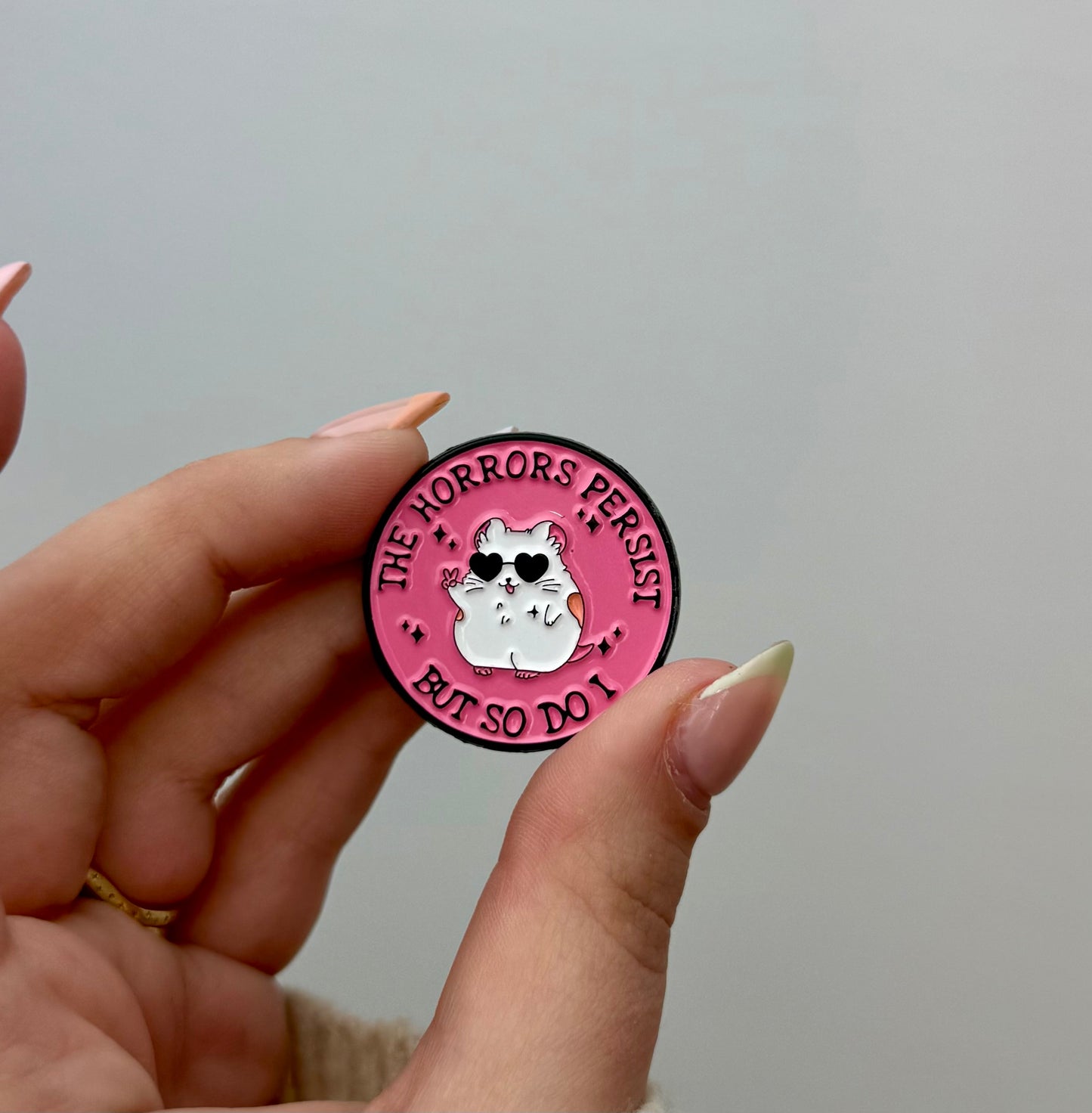 Horrors persist enamel pin
