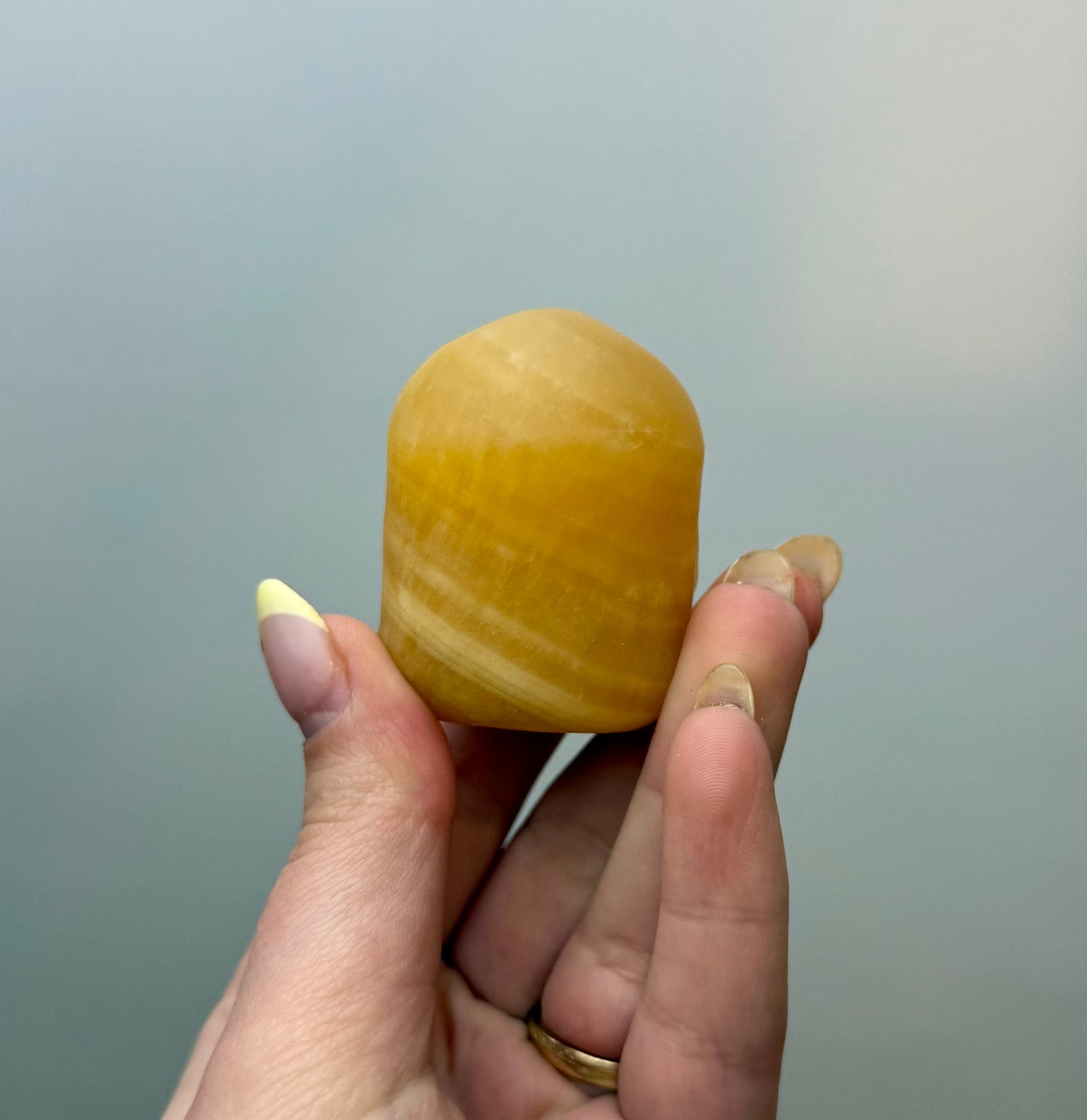 Orange calcite minion carving