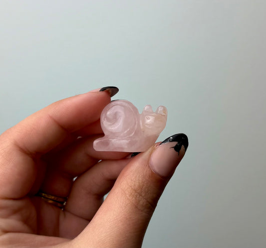 Rose quartz snail carving
