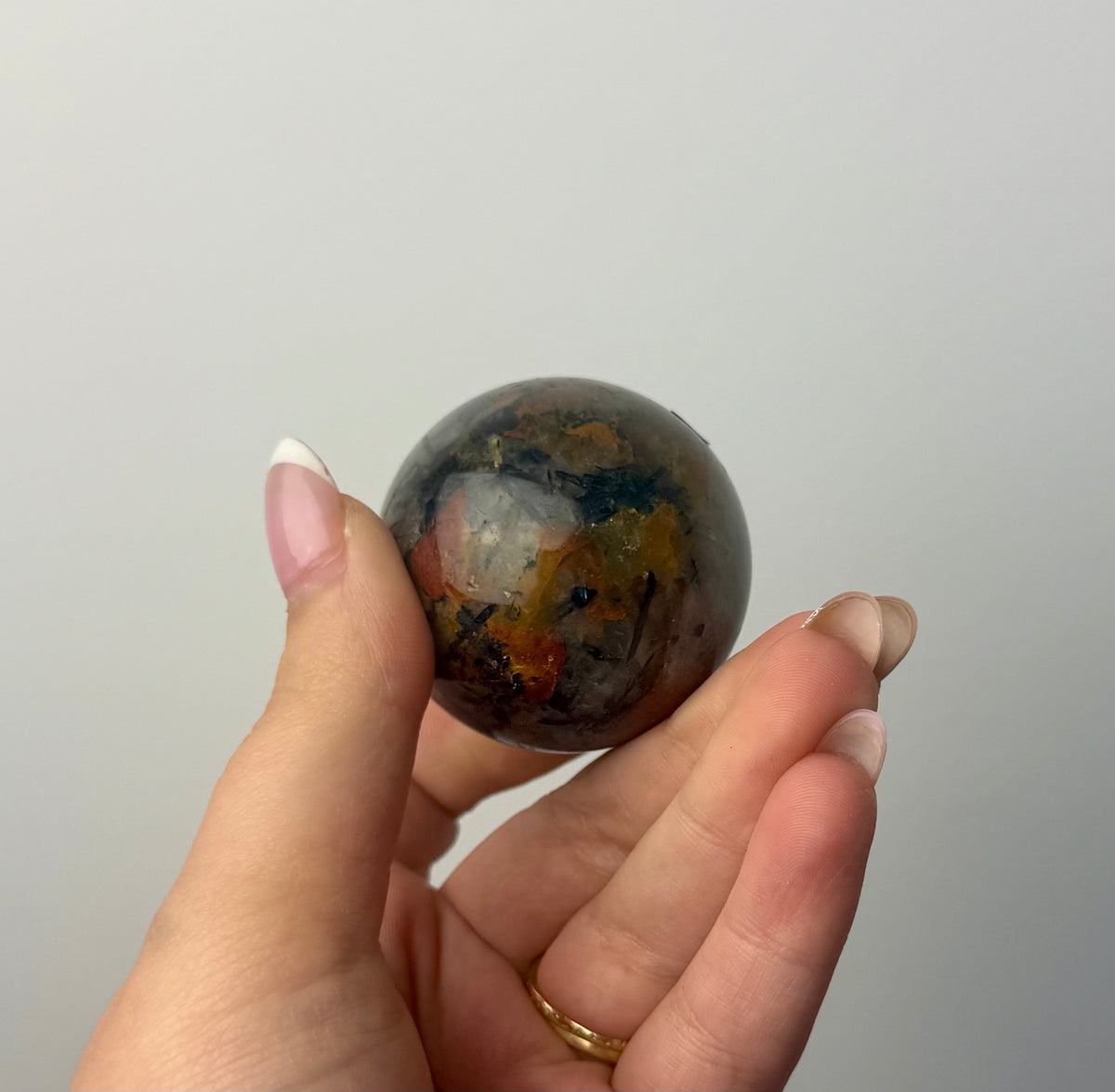 Black tourmaline in quartz sphere