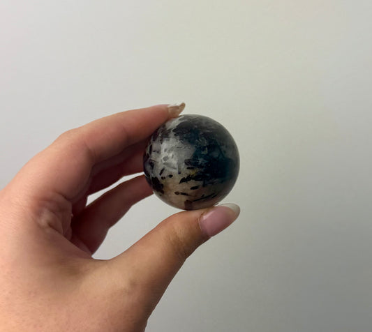 Black tourmaline in quartz sphere