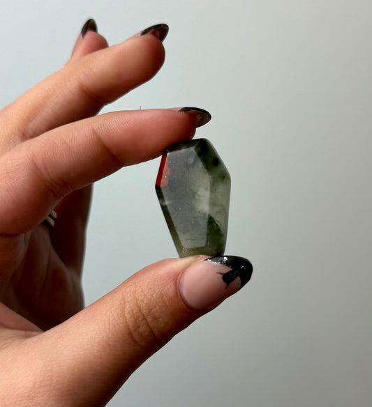 Bloodstone coffin carving
