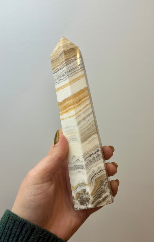 ￼ Dendritic orange calcite tower