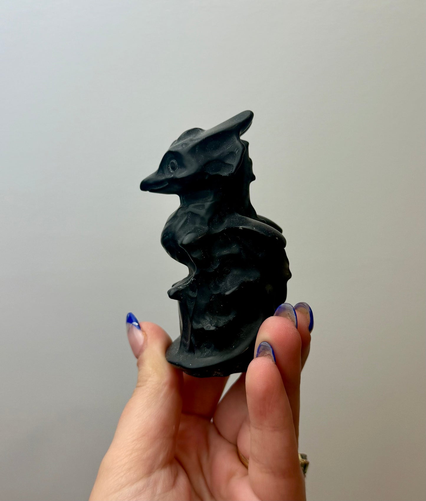 Obsidian dragon carving