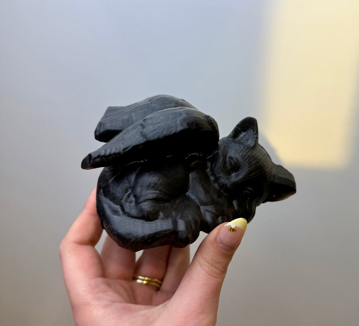 Obsidian angel cat carving