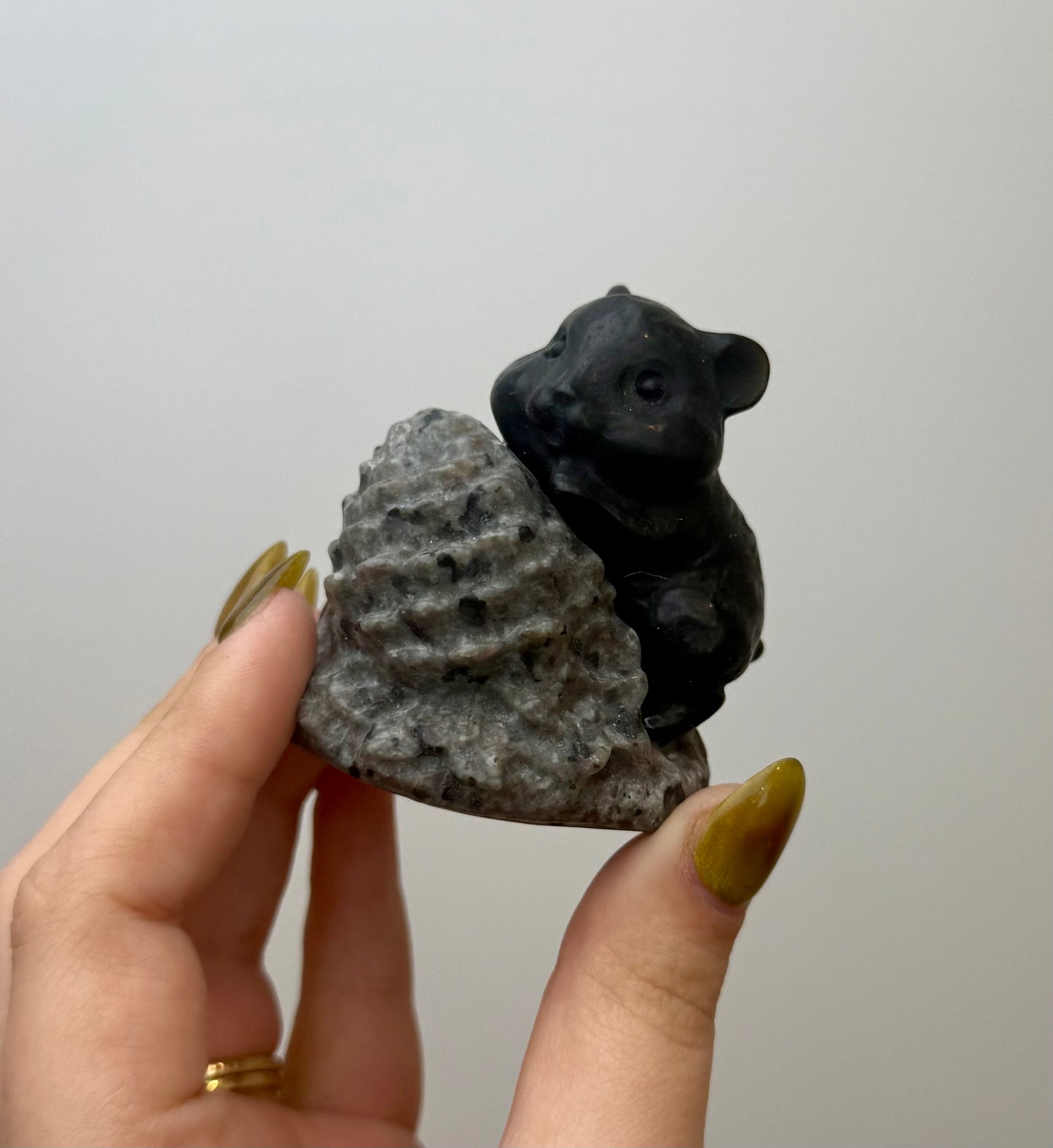Hamster with pinecone carving