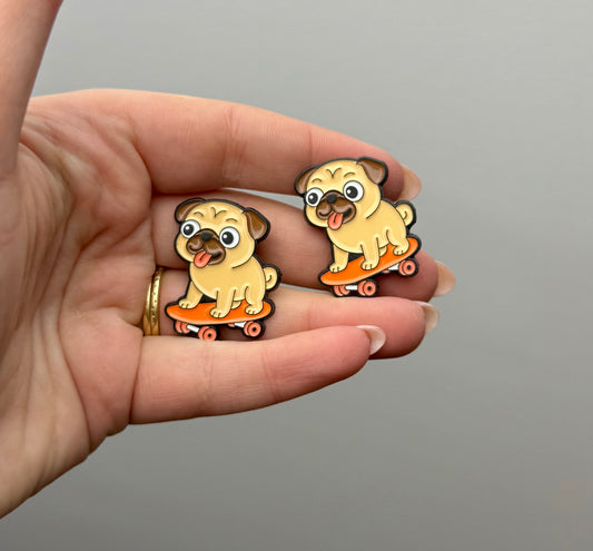 Pug dog on skateboard enamel pin