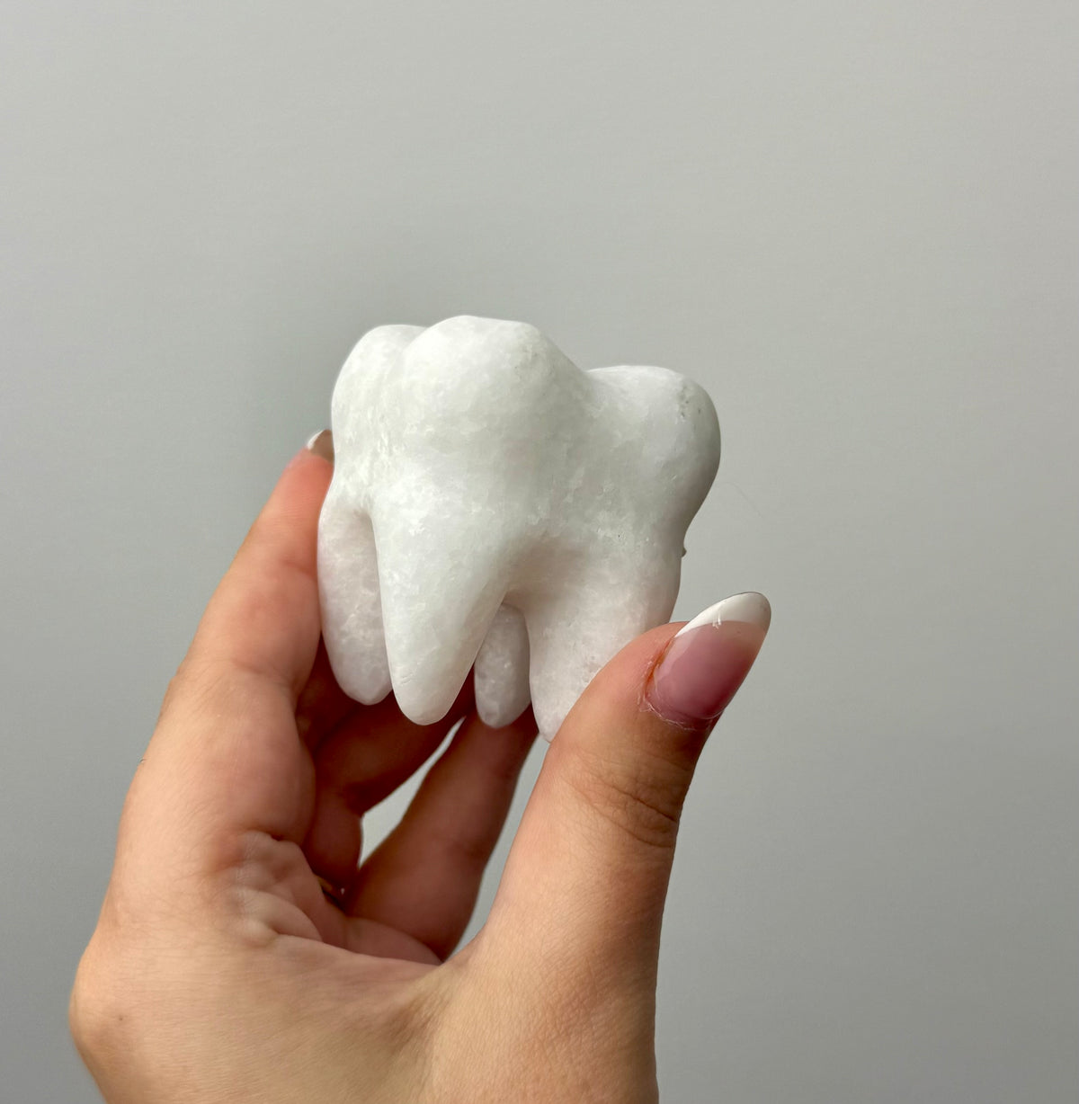White jade tooth carvings