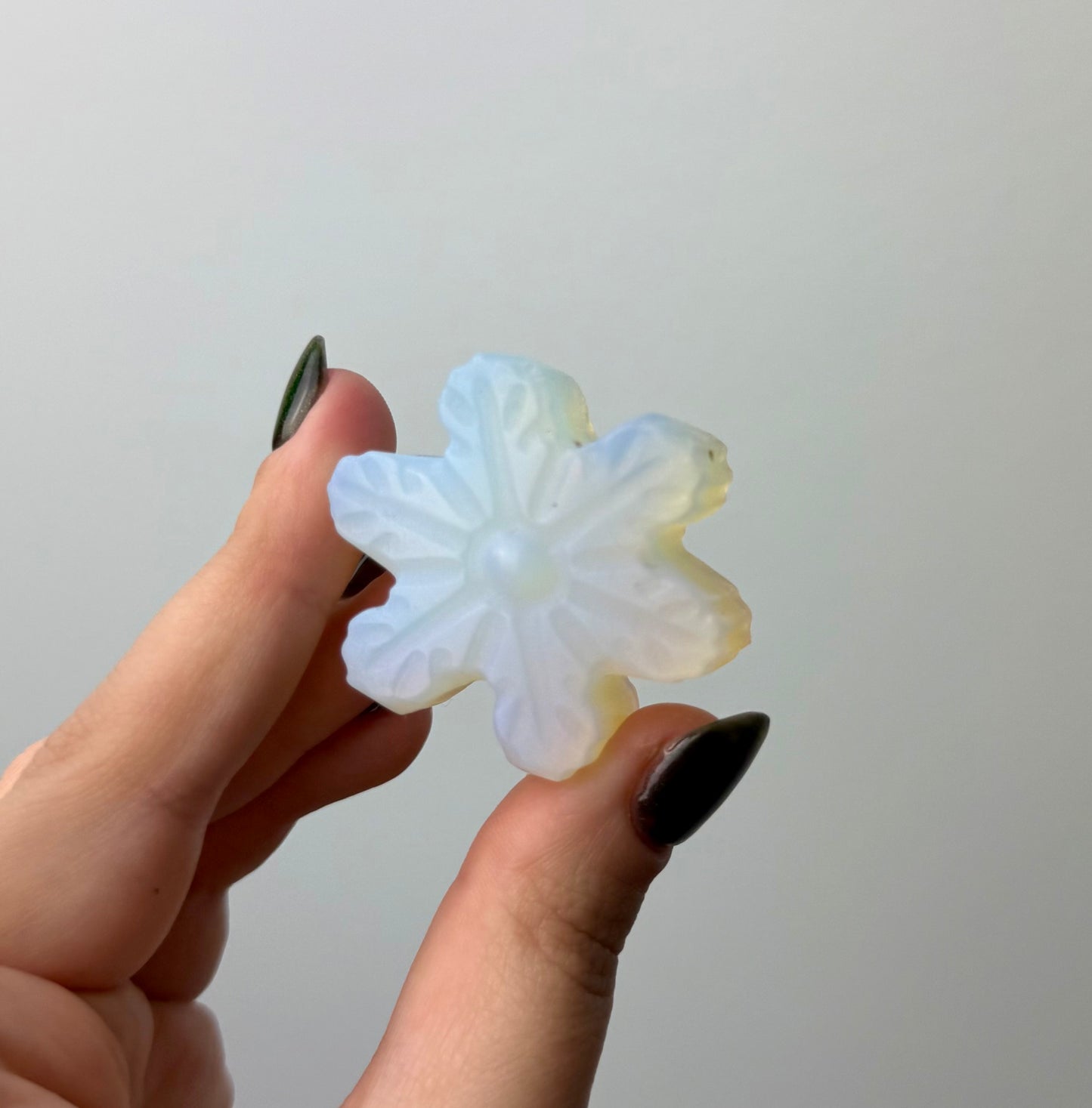 Man made material Opalite snowflake carving